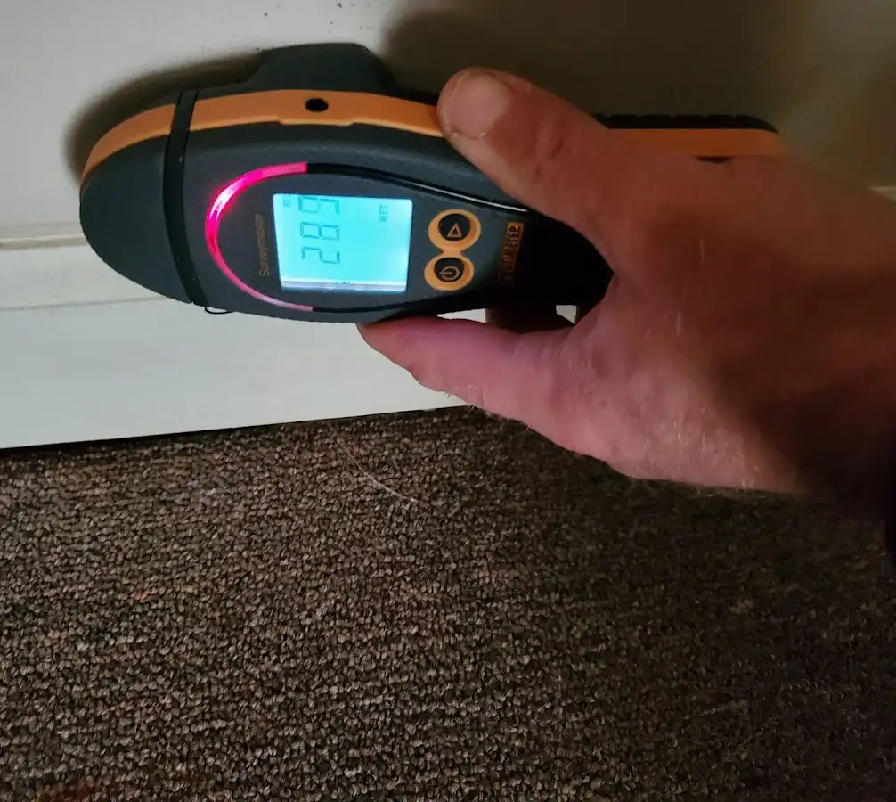Moisture detection at baseboard during Storm Damage Restoration in Phoenix
